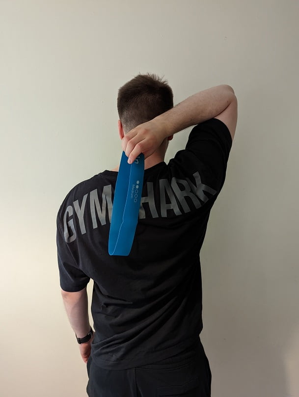 first step for shoulder internal rotation - hold the band behind the back