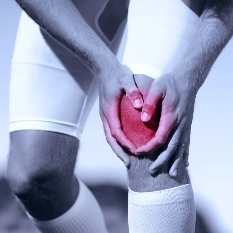 man who has injured his knee during sports