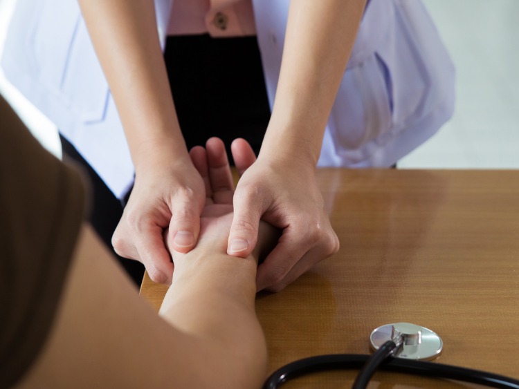 Examination of the wrist by a hand doctor