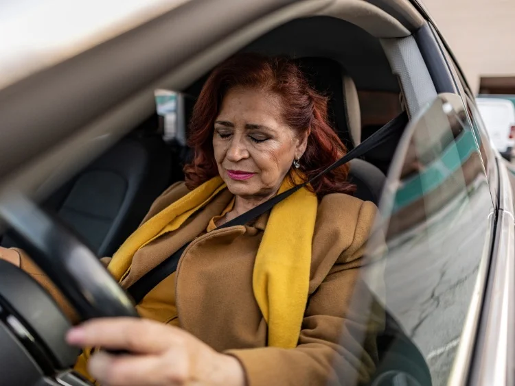 Lady in pain while driving