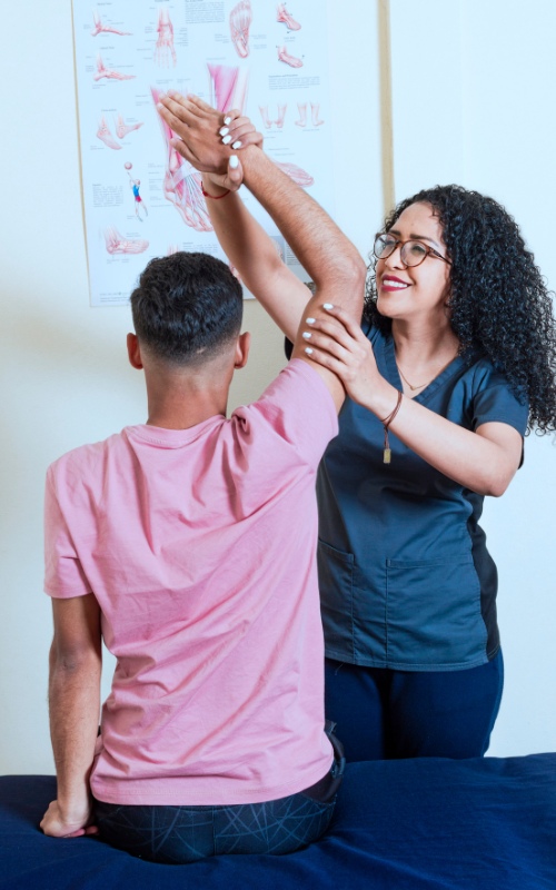 man getting physical therapy on his arm