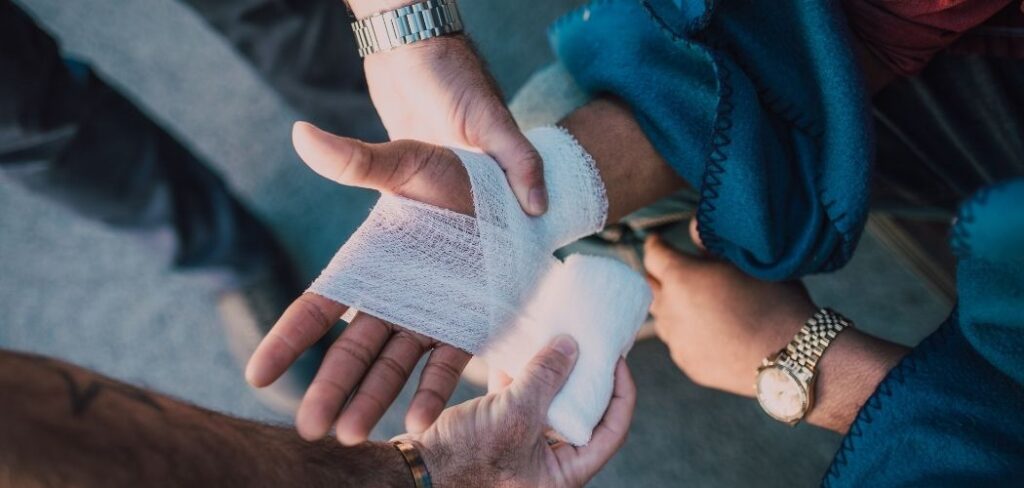 Hand being wrapped in bandage