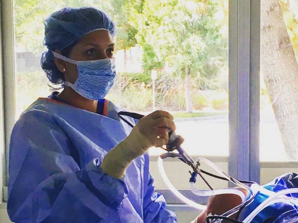 Surgeon performing knee arthroscopy