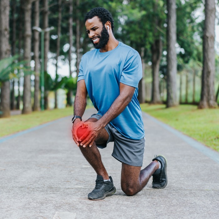 Athlete struggling to bend knee