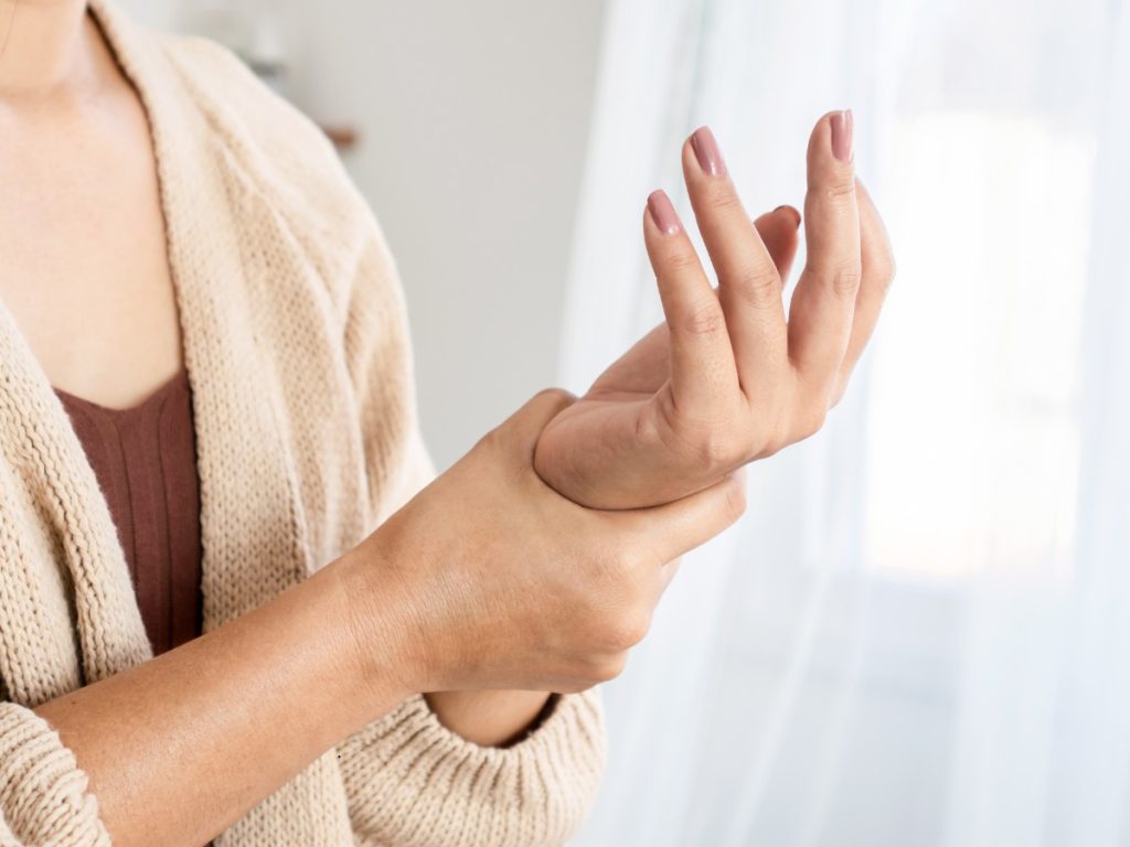 Woman clutches painful left wrist