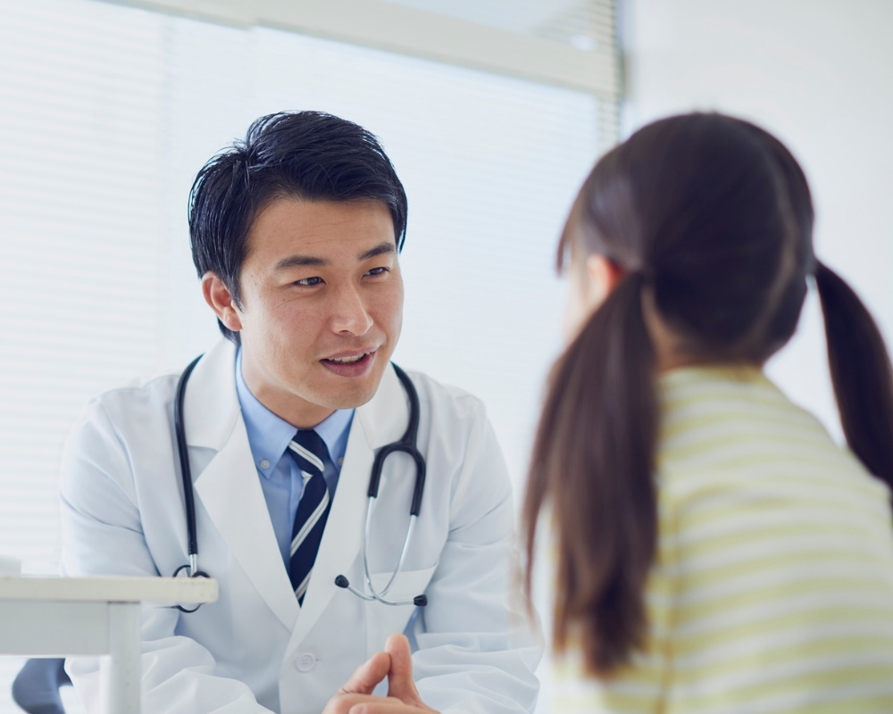 Doctor consulting child
