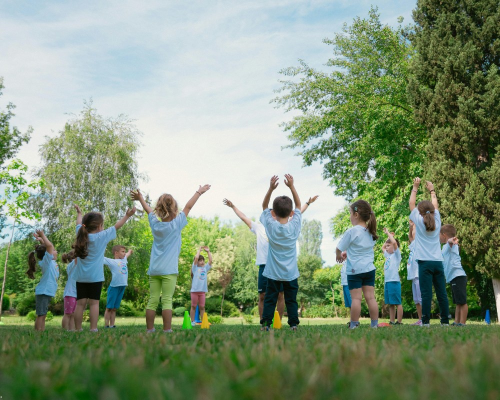 Group of children stretching before exercise in a public park (1)