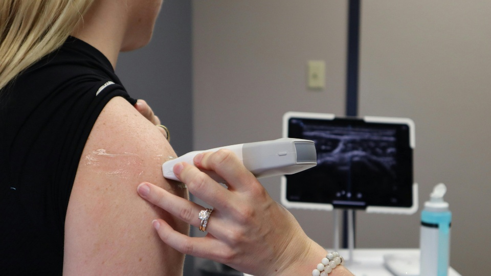Patient receiving shoulder treatment