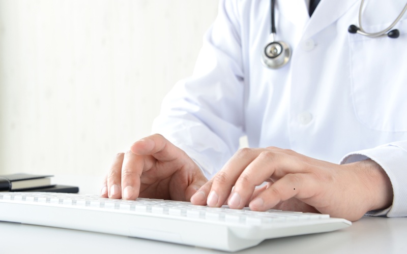 Doctor using a computer keyboard