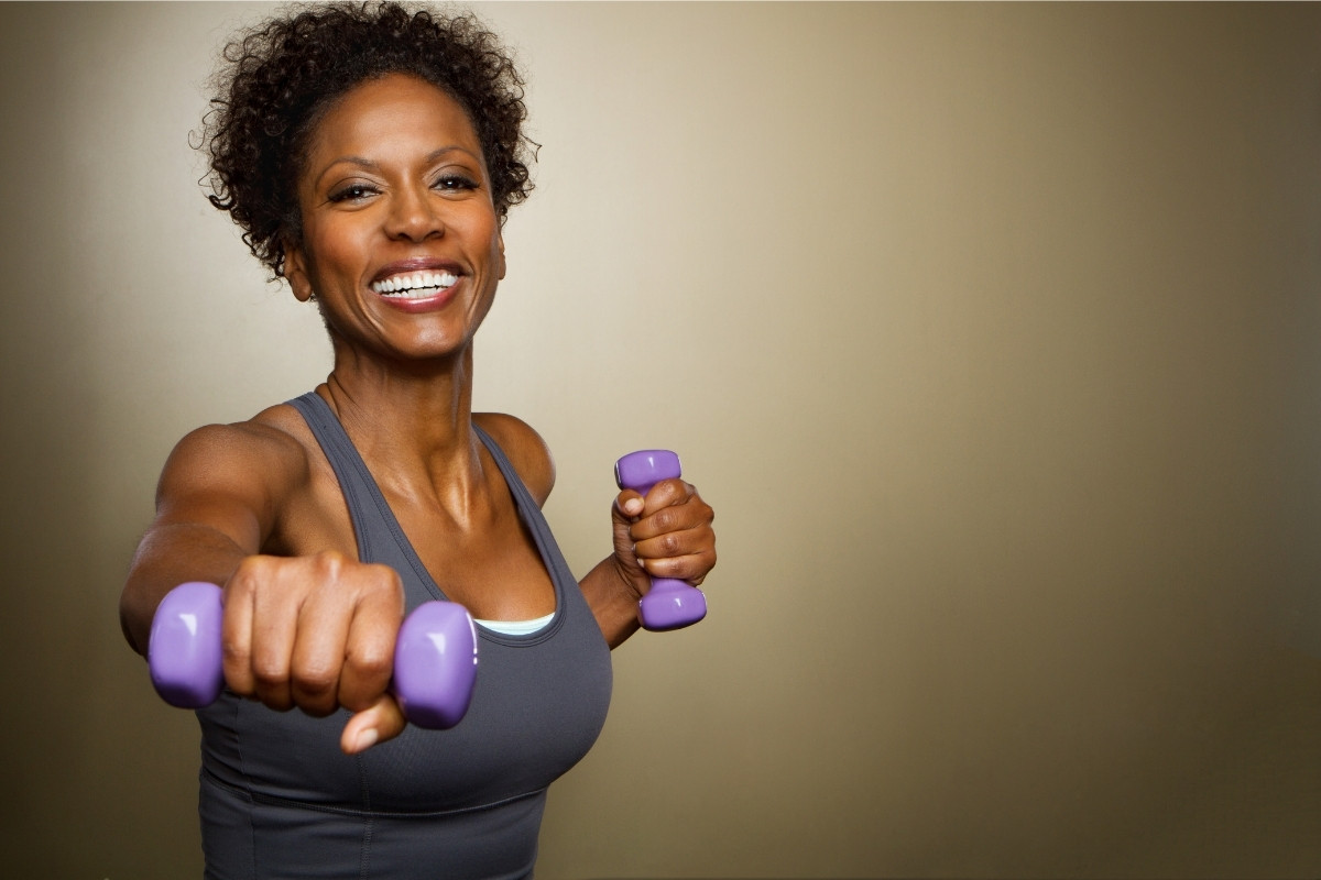 Female works out with light dumbbells