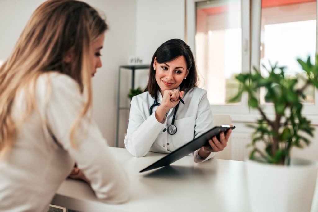 Female doctor consulting female patient