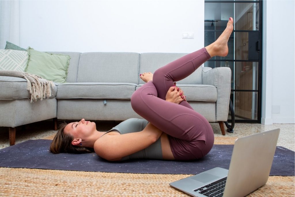 Female doing at home hip stretches