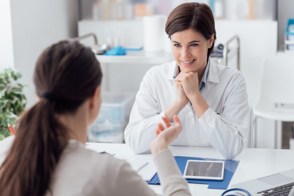 Female doctor with female patient