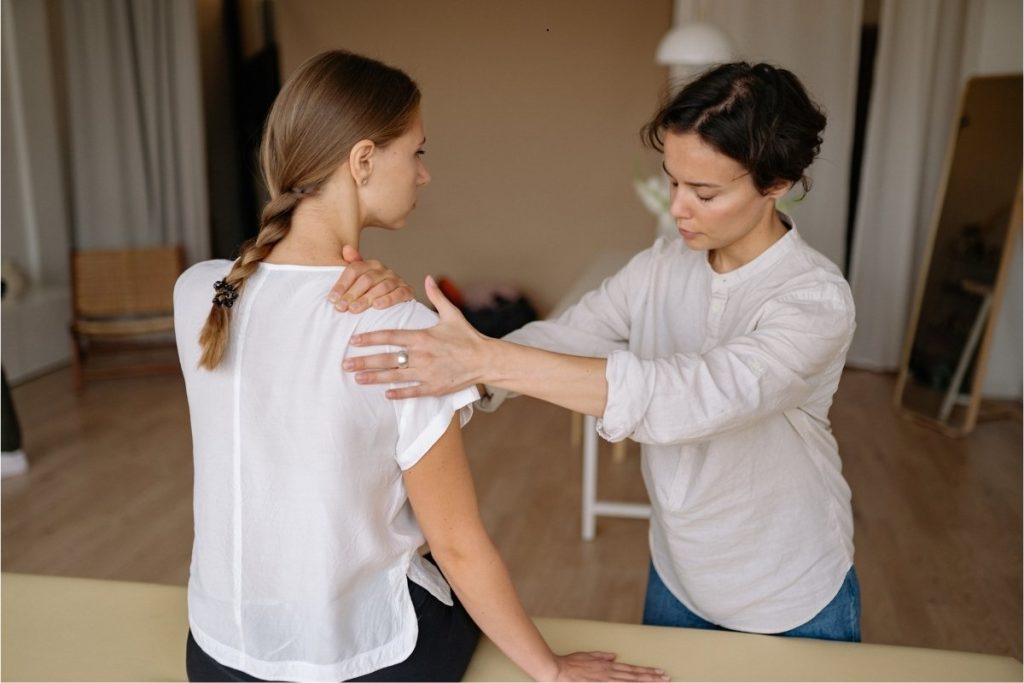 Female physical therapist treating a female client