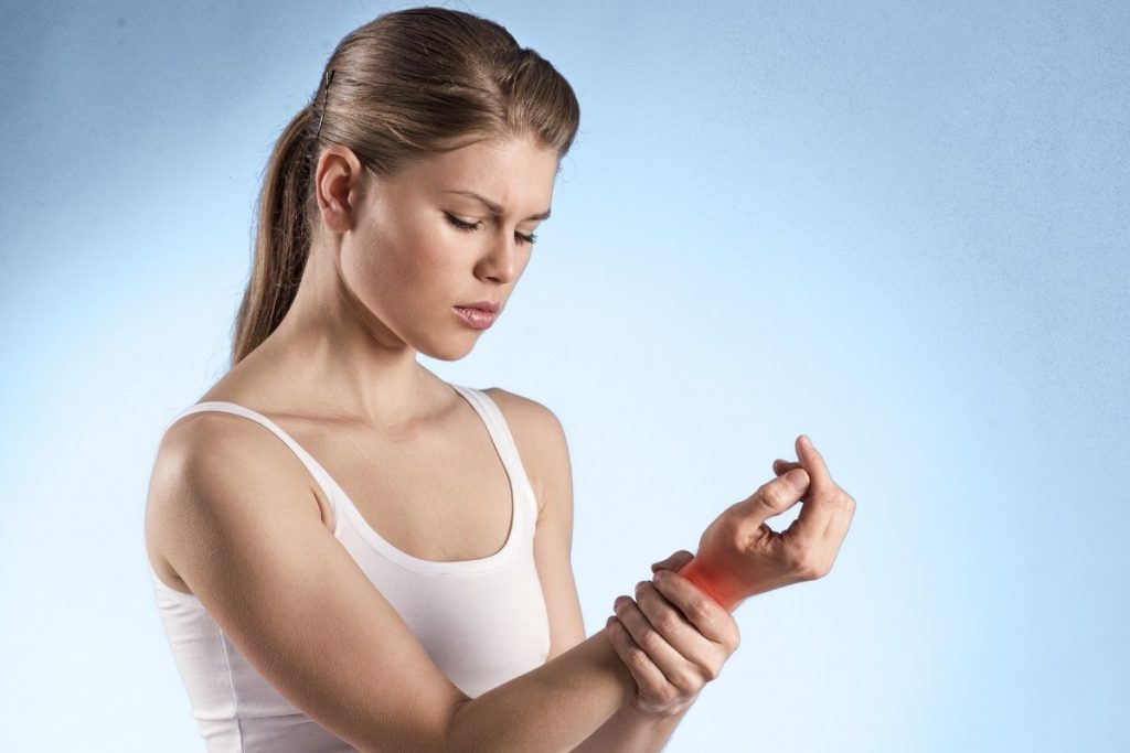 Female holding wrist in pain