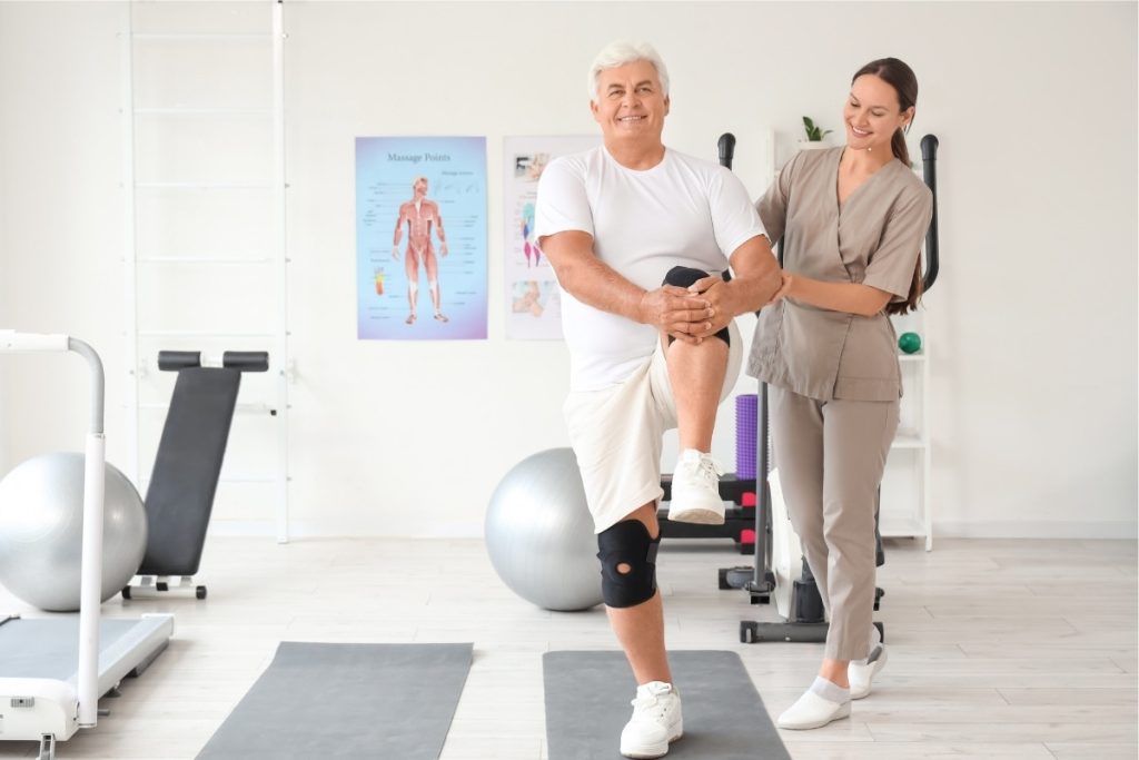 Elderly male patient going through hip physical therapy